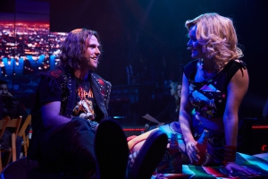 Drew (Ian Ward) and Sherrie (Callandra Olivia) get close in Rock of Ages Hollywood